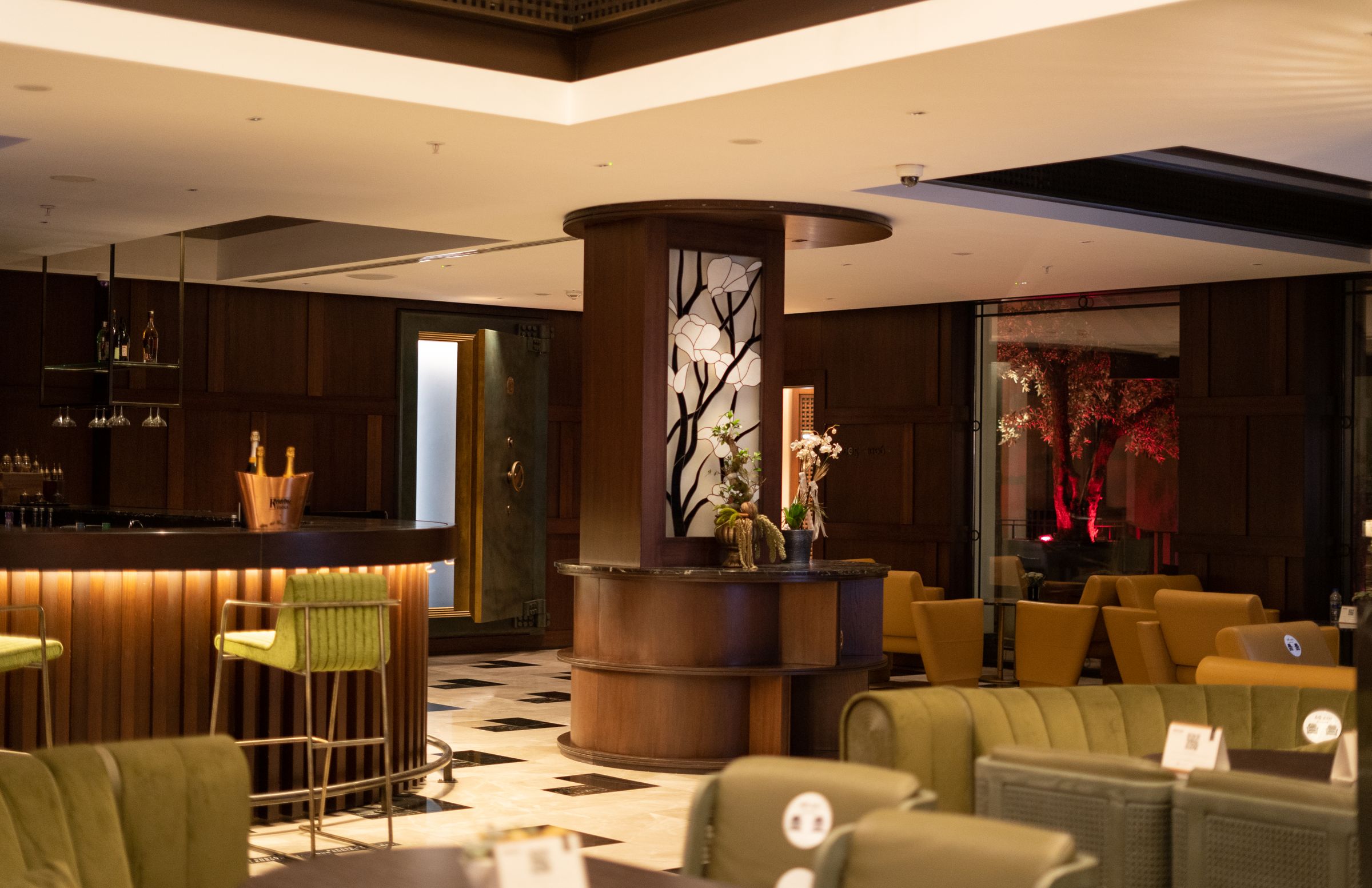 Hotel lobby bar with warm light and natural materials